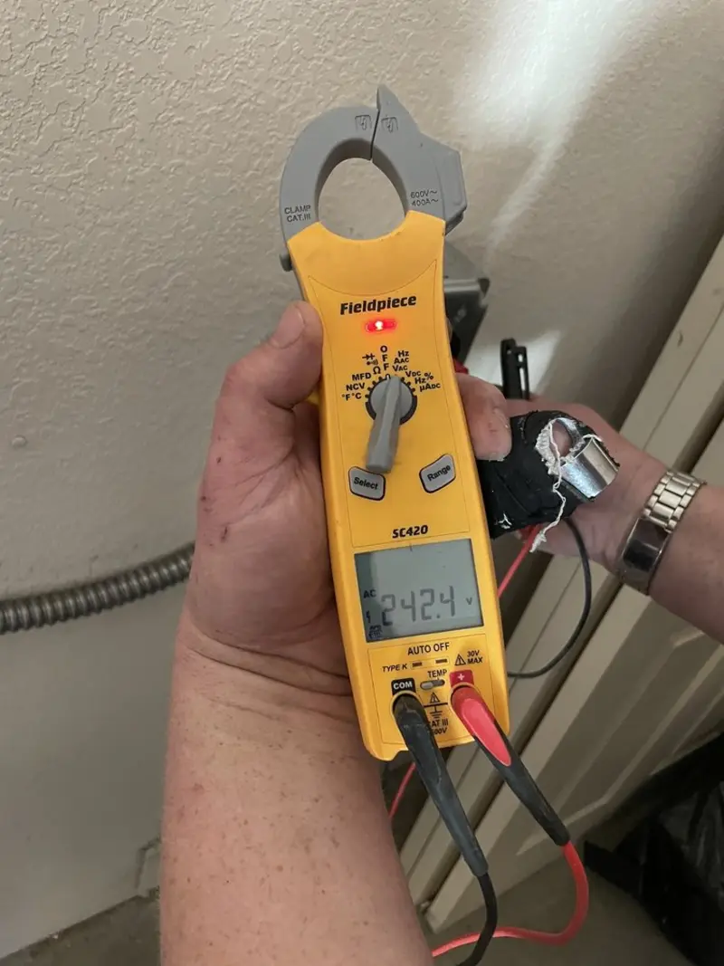 Voltage testing with clamp meter during Whole House Surge Protector in Waxahachie